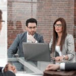 Professional Services Industry Professionals Collaborating Around a Table