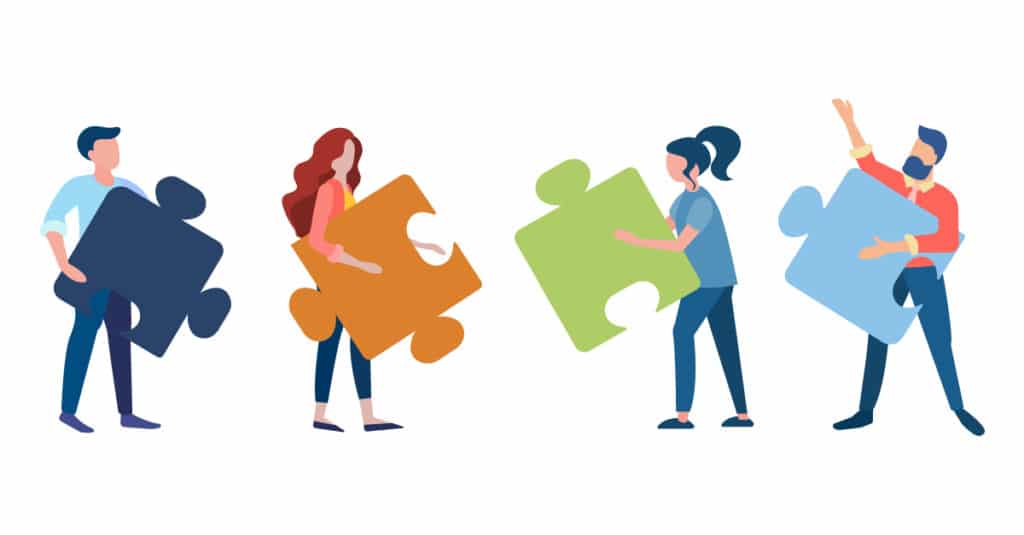 Business People Holding Puzzle Pieces and Collaborating to Put Them Together- collaboration in professional services