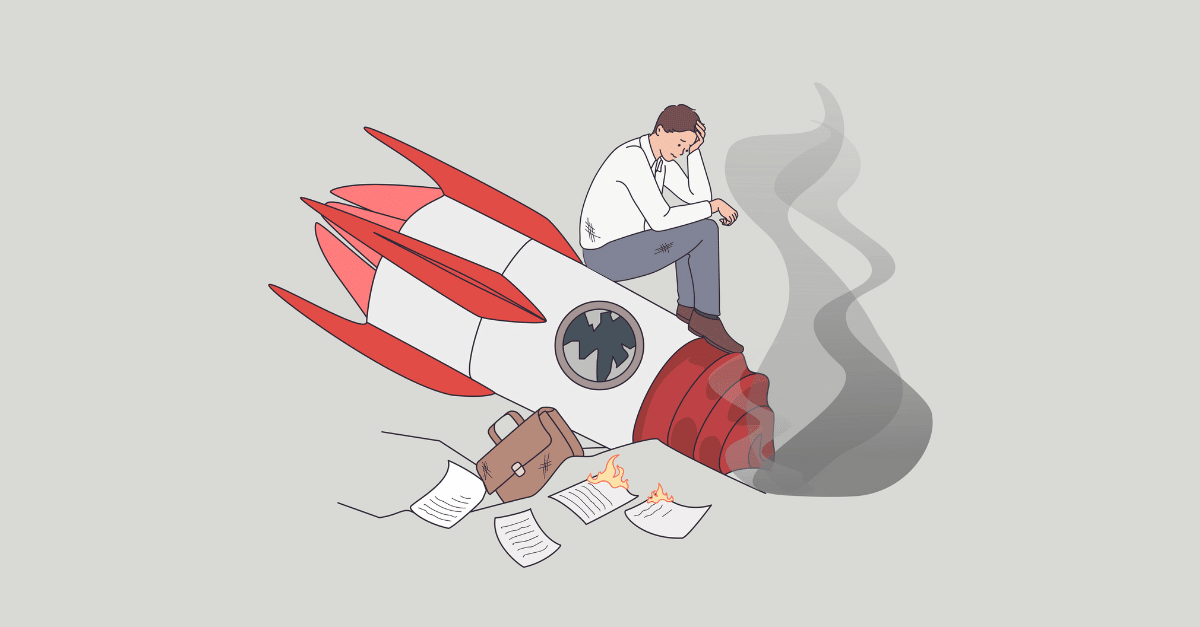 Illustration of a frustrated businessman sitting down on top of a crashed rocket