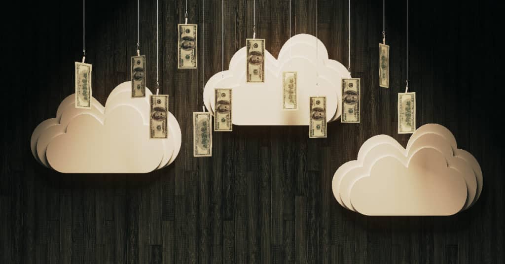 Cutout Clouds and Money Hanging from Wires Over a Stage