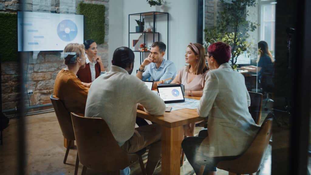 Business people around a desk working on digital transformation project