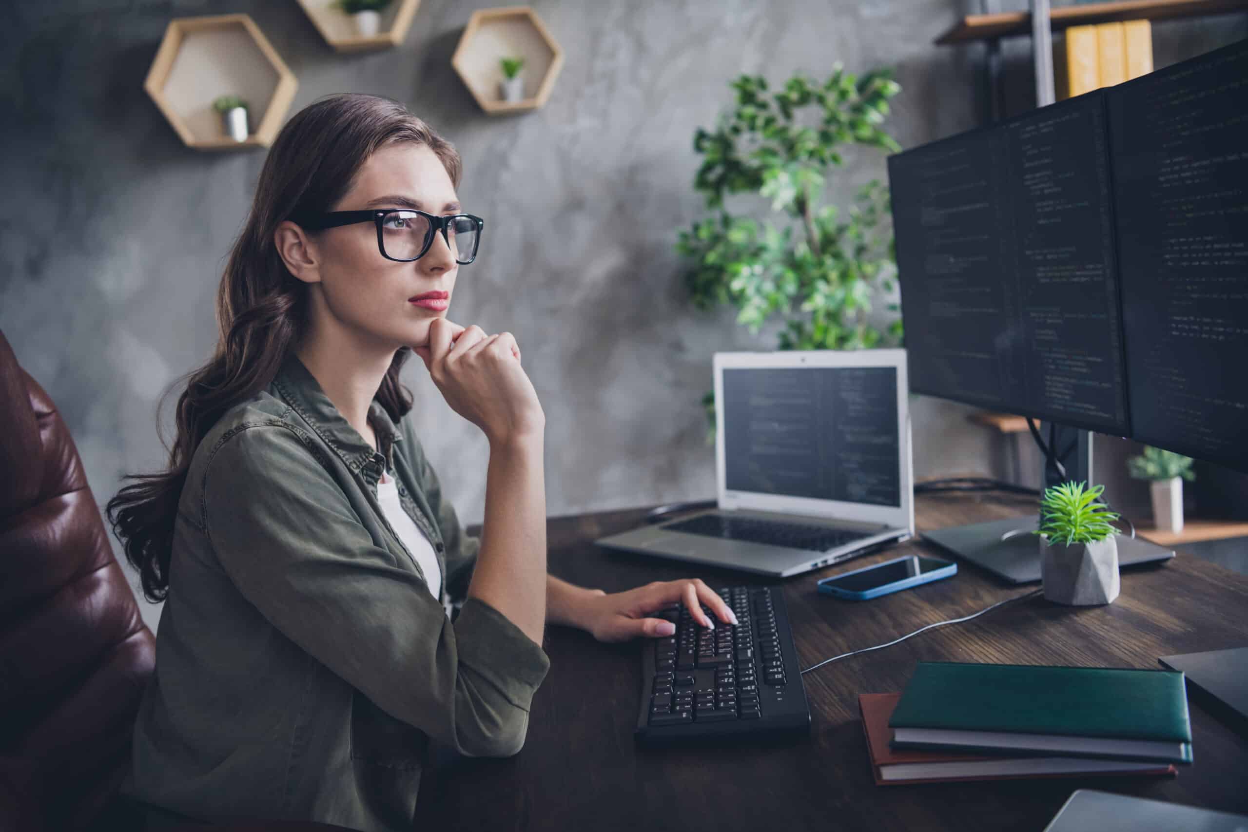 Woman in an office thinking about something