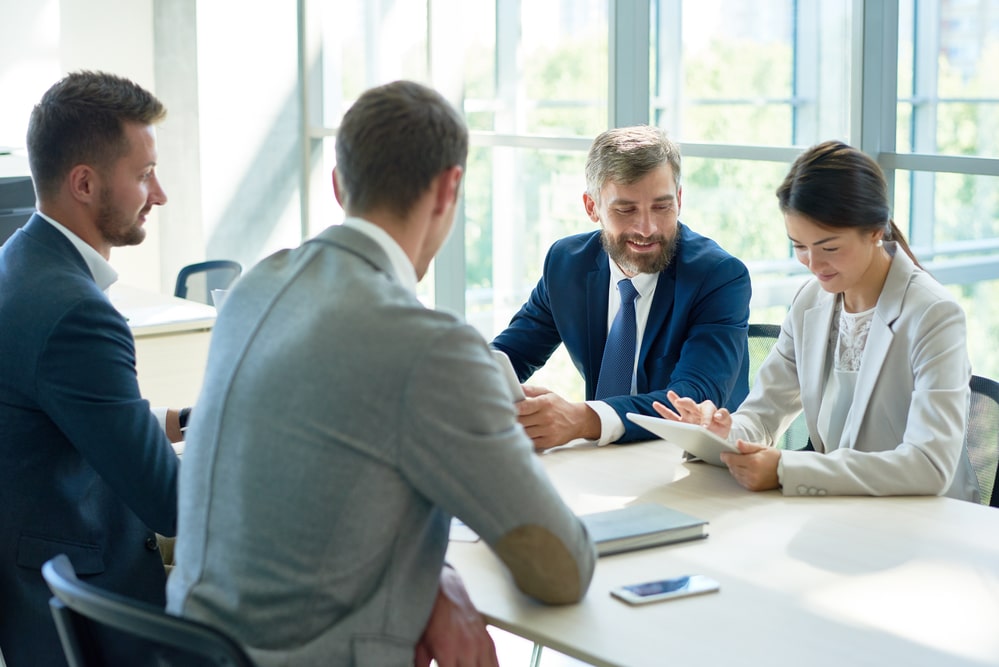 Four coworkers chatting