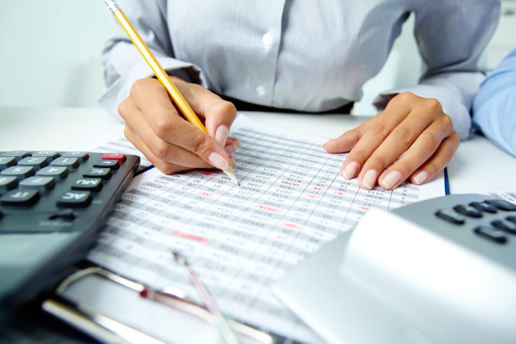 woman reviewing her Accounting notes- project accounting in professional services