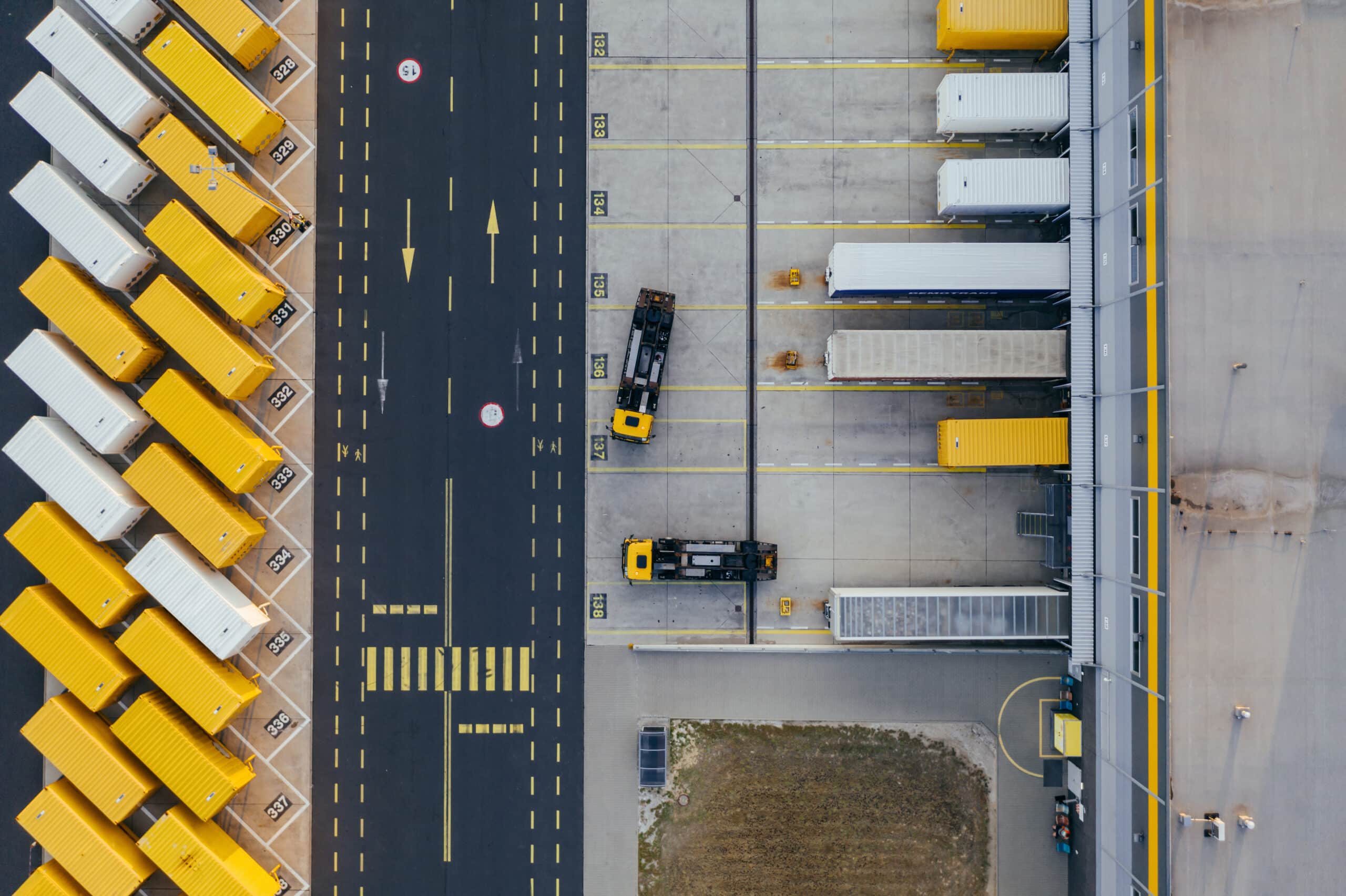 Fleet of trucks and containers arial shot