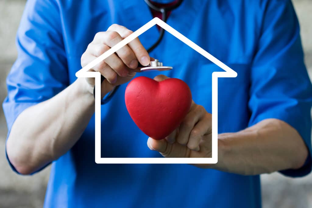 Doctor pushing button house home virtual healthcare network