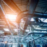 Air conditioning of buildings. Background of ventilation pipes.